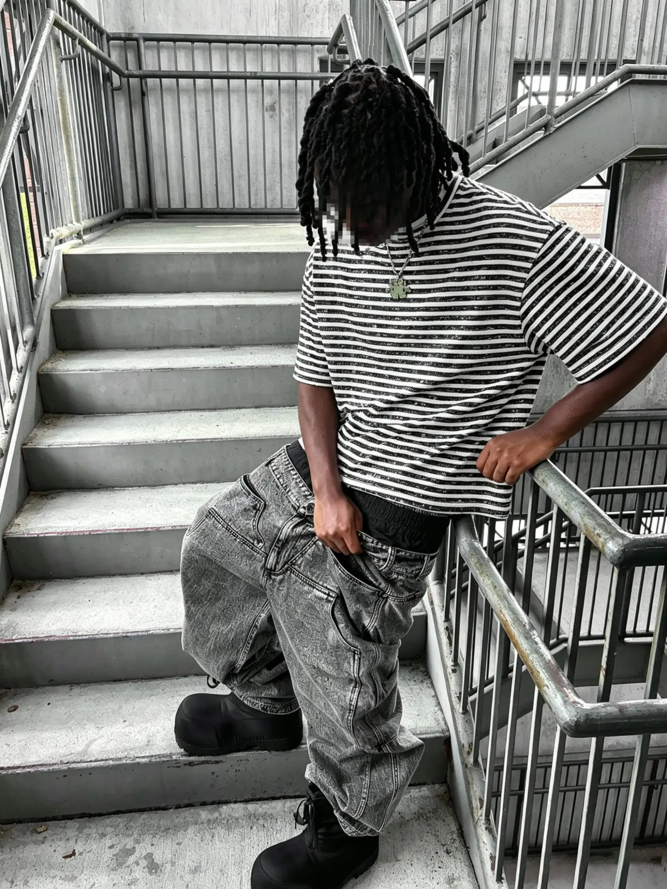 A cropped, drop-shoulder, relaxed fit, Crew neckline T-shirt, Menswear, featuring a black-and-white striped pattern, crafted from soft cotton with a vintage-effect textured finish, essential casual wardrobe staple for everyday streetwear style