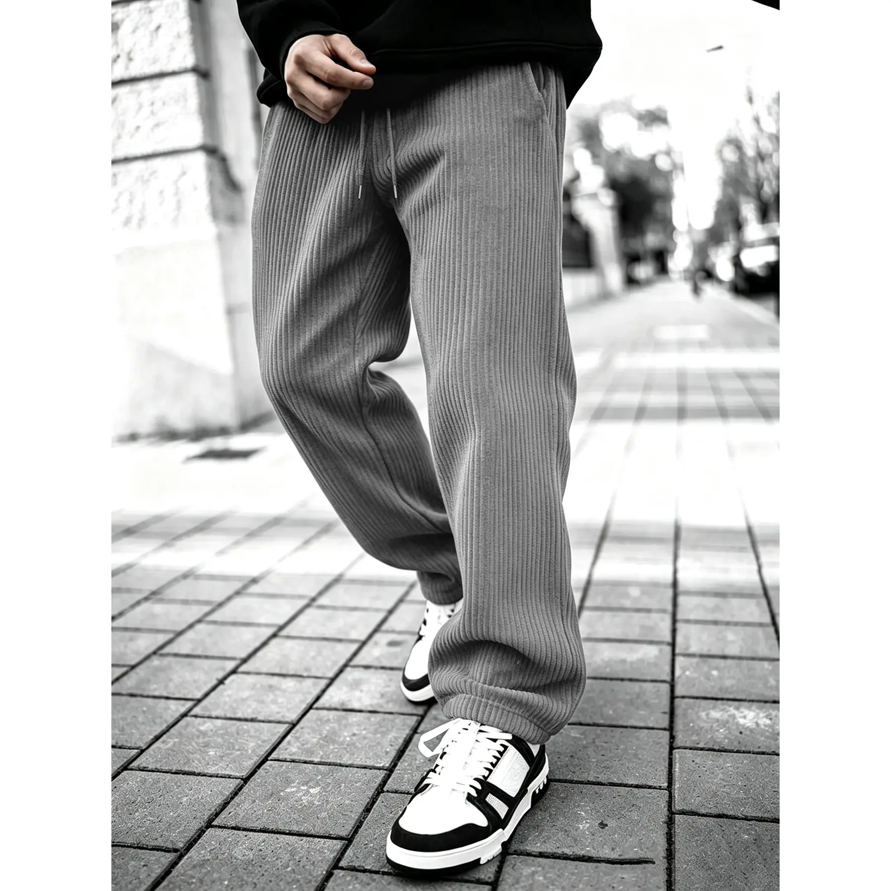 Vertical ribbed corduroy jogger pants with elastic drawstring waist and cuffed ankle hem, soft textured loose relaxed silhouette deep side pockets casual daily bottom staple for vintage street mensfashion styling