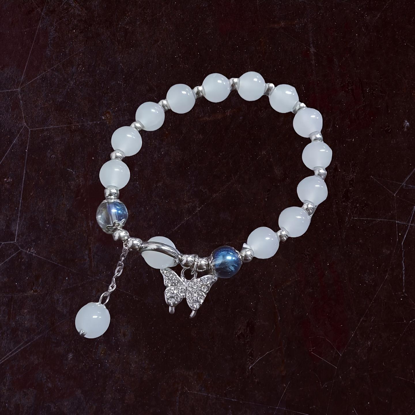 An elegant glass bead bracelet featuring a star pendant-a sophisticated, faux cat's-eye style accessory suitable for women and individuals aged 15 and up. Perfect for Valentine's Day, Carnival, and Christmas parties.