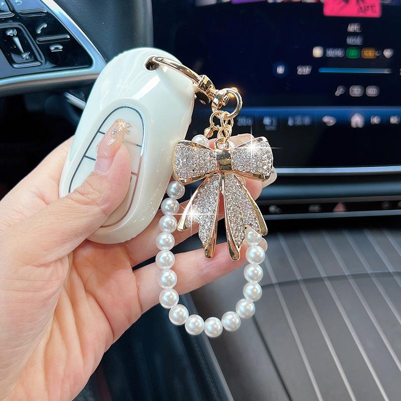 Rhinestone Bow Keychain with Pearl Wrist Strap, Luxury Bling Bow Car Key Ring, Elegant Metal Bag Charm Accessory for Women