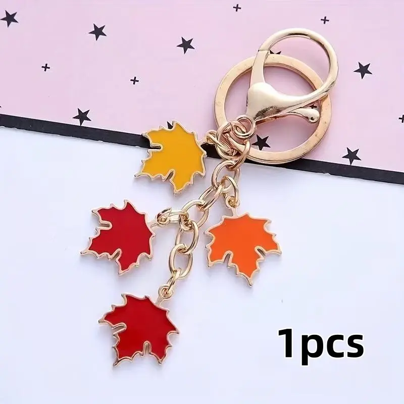 1 piece of the new maple leaf keychain pendant. Creative colorful leaf alloy accessory for headphone case, keychain, and bag decoration.