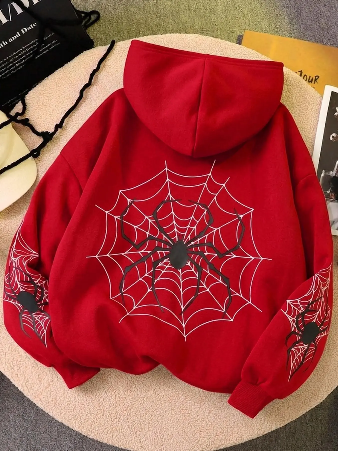 Red spiderweb pattern hooded sweatshirt, Y2K gothic style long-sleeved pullover, streetwear style, casual everyday look, a style worn by fashionistas.
