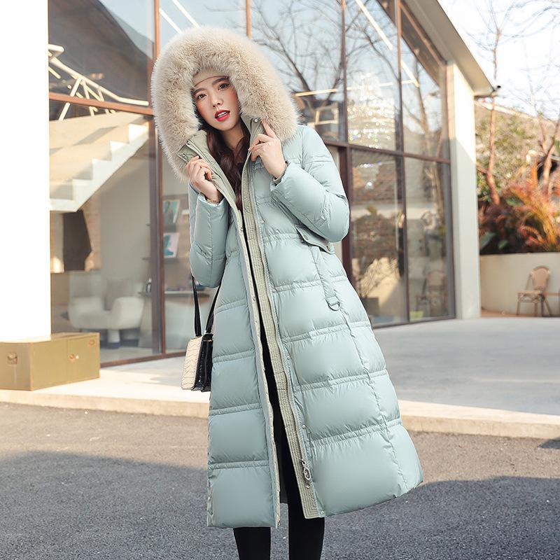 New winter women's thickened long over-the-knee hooded cotton-padded coat with large fur collar.