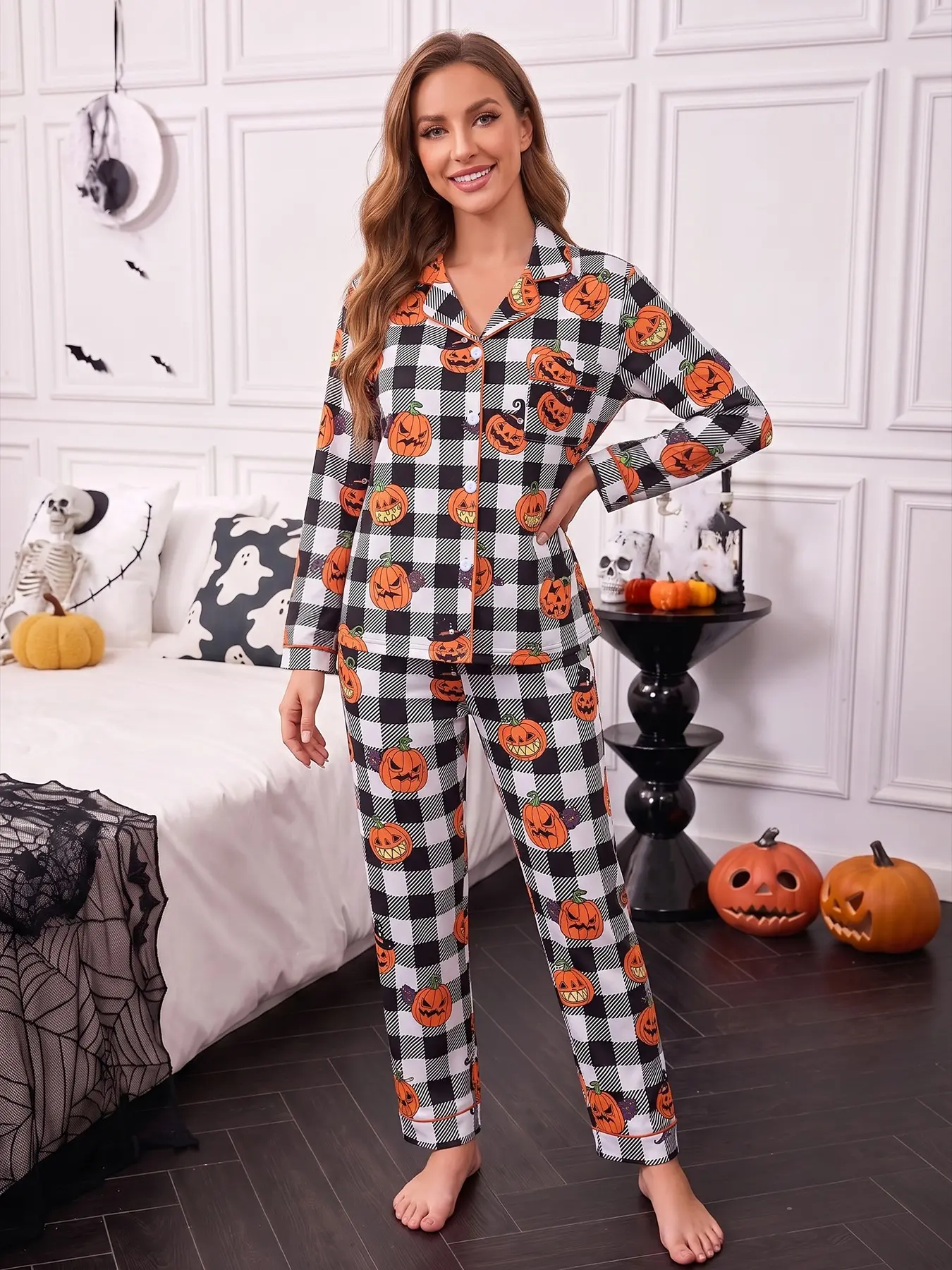 Women's 2-piece pajama set, black and white buffalo plaid printed with Halloween jack-o'-lanterns & black cats, retro trendy Halloween style. Orange piping lapel top with pocket, soft elastic long pants, all-season casual women loungewear pjs