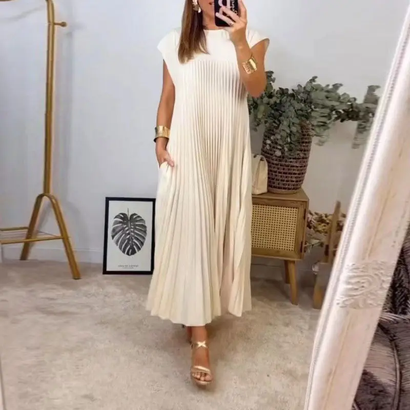 New elegant and stylish dress with a round neckline, sleeveless, pleated, and long in length