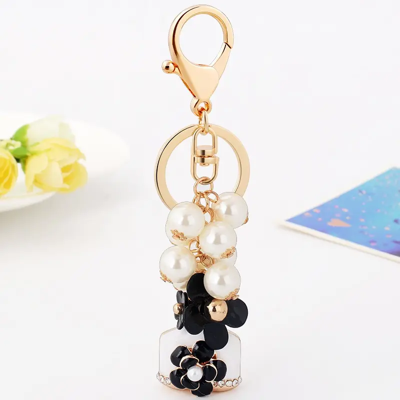 Korean Style Camellia Pearl Keychain Bag Charm with Perfume Bottle Pendant Elegant Flower Charm Aesthetic Purse Charm for Women Girls Handbag Backpack Key Ring Fashion Gift