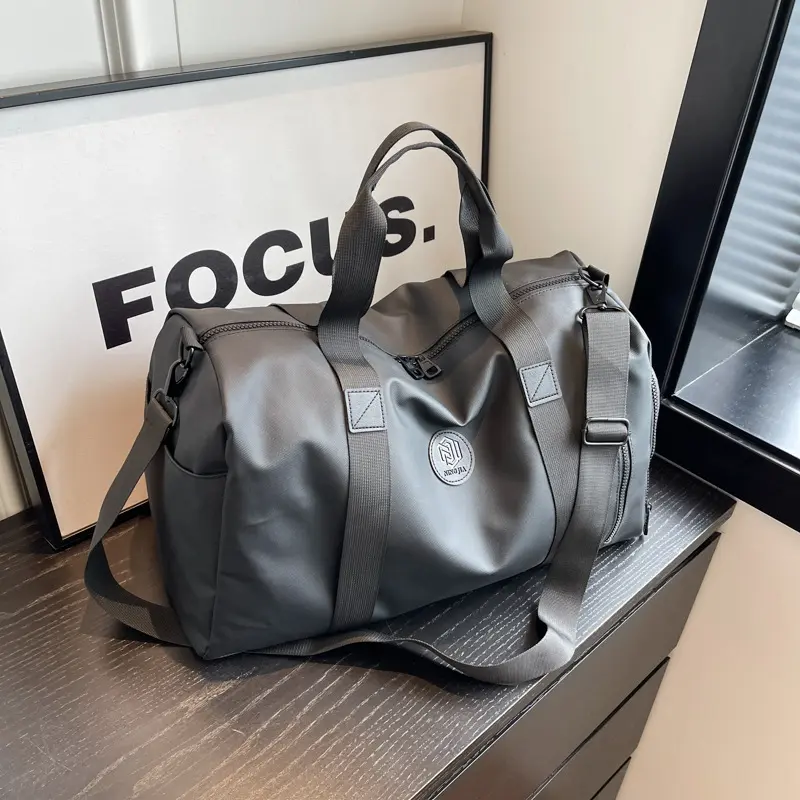 A stylish, high-capacity travel bag featuring a separate shoe compartment and a luggage trolley sleeve; a fashionable overnight or weekend bag suitable for the gym, campus, travel, and outdoor activities.