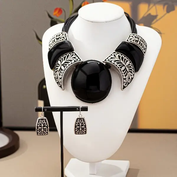 A necklace + a pair of earrings, bohemian exaggerated black geometric pattern relief creative multi-layer fashion women's jewelry