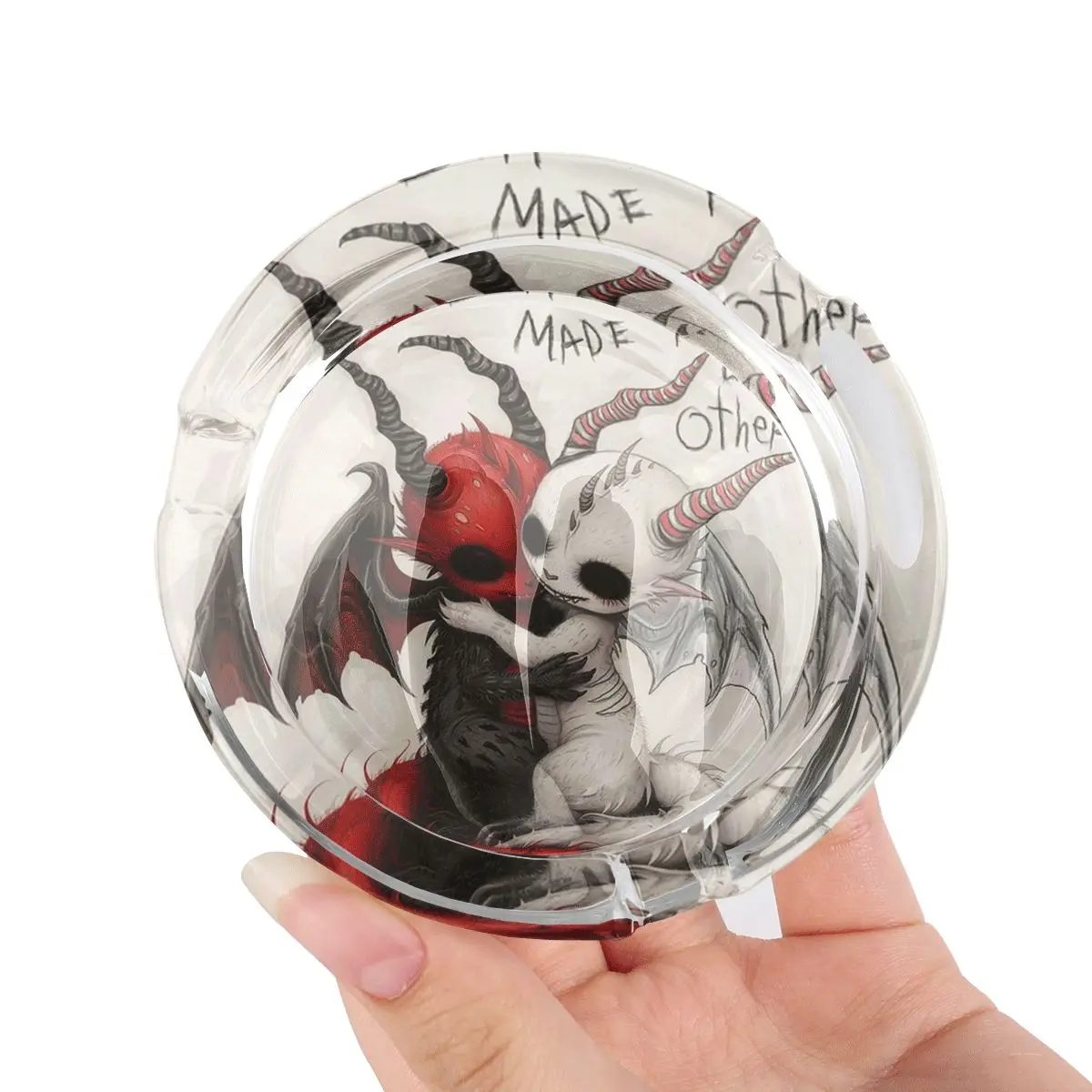 A circular cigarette ash cylinder with an anti slip base, showcasing a charming demon themed design, perfect for home, office, and bar use - a stylish and practical ash cylinder suitable for fans of fantasy themes