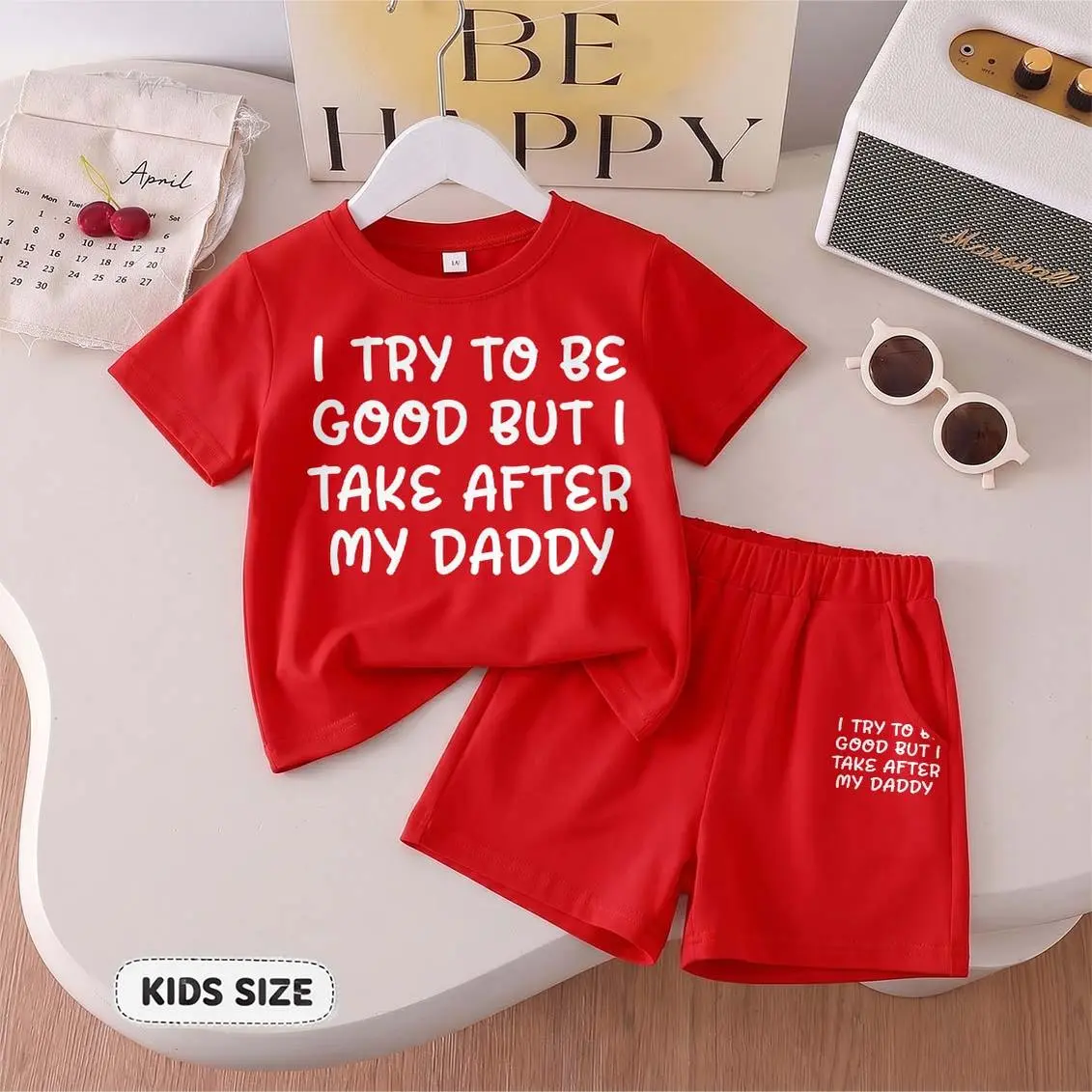Kids’ “I Try To Be Good But I Take After My Daddy” Cartoon Print Short-Sleeve T-Shirt And Shorts Set—Casual Summer Kids' Clothing. This Round-Neck Outfit Combination Is Perfect For Everyday Wear And Outdoor Play.