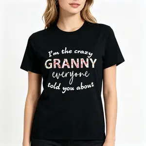 "The Wild Grandma Everyone Talks About Funny Humorous Grandmother Gift Chaos Nana Matriarch Family Humor Statement Graphic Tee" Graphic Unisex Tee |   All-Season Breathable Top