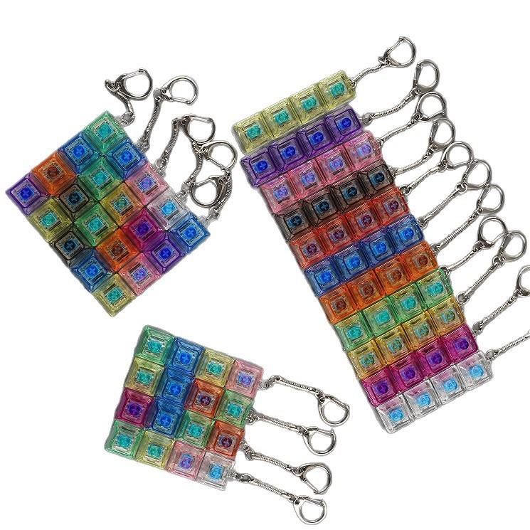 4-key decompression button, Russian Tetris keychain, mechanical key with light-emitting function, stress-reducing fingertip toy key.
