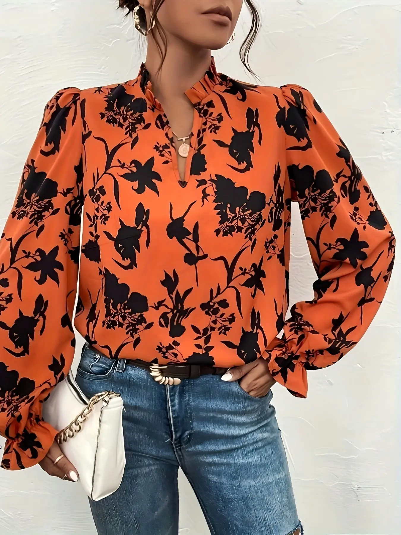 One orange floral-print V-neck long-sleeved shirt with wide sleeves, suitable for both work and vacation.
