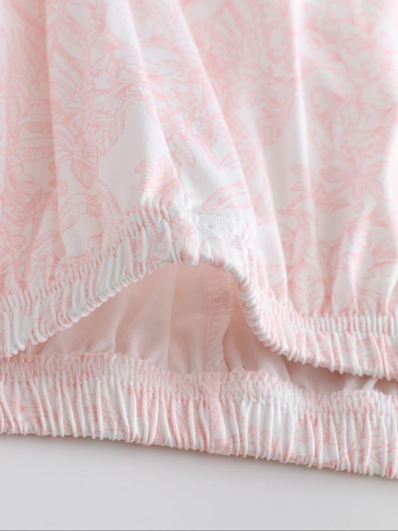 Two-piece pink ladies' pajama set with full-color prints. Button-front collar shirt and elastic waist pants pajama. Casual and comfortable collar long-sleeved top and long pants pajama set. Ladies' pajamas for spring and autumn.