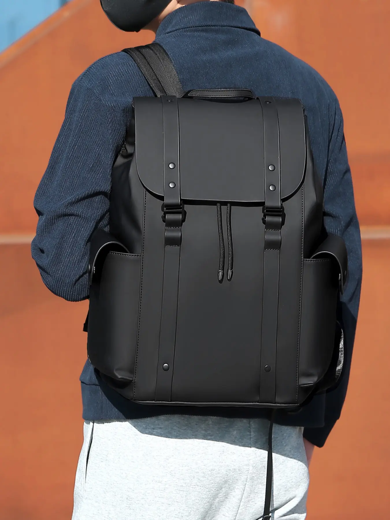 1pc Solid Matte Black Leather Spliced Men Commuter Backpack Flap With Rivet Strap Buckles Central Drawstring Closure Dual Fold-out Side Storage Pockets Top Carry Handle Spacious Laptop-compartment Rucksack For Office Daily Commute