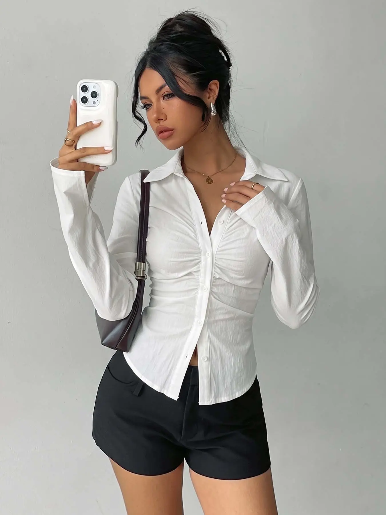 Ladies' fashionable white pleated long-sleeve shirt, button-down hem fitted All Season top, soft and comfortable casual texture, minimalist aesthetic, suitable for office, brunch dates, city shopping, coffee meet-ups, and weekend getaways.