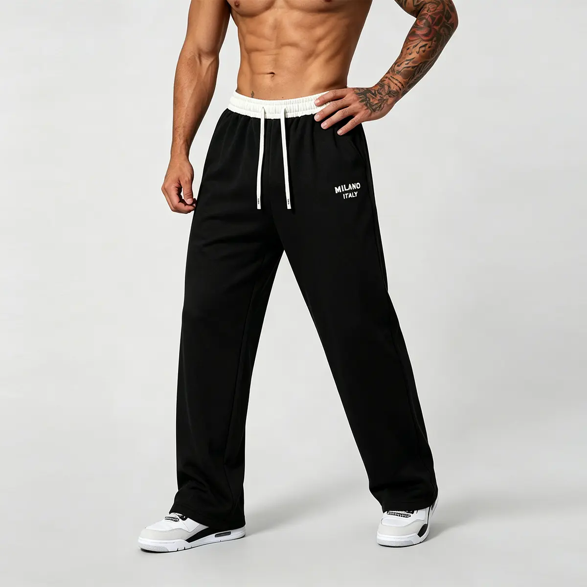 Men's Contrast-Waistband Wide-Leg Sweatpants - Black Main Body with "MILANO ITALY" Embroidered Left Thigh Detail, White Elastic Waistband with Adjustable Drawstring for Personalized Fit, Side Pockets for Phones