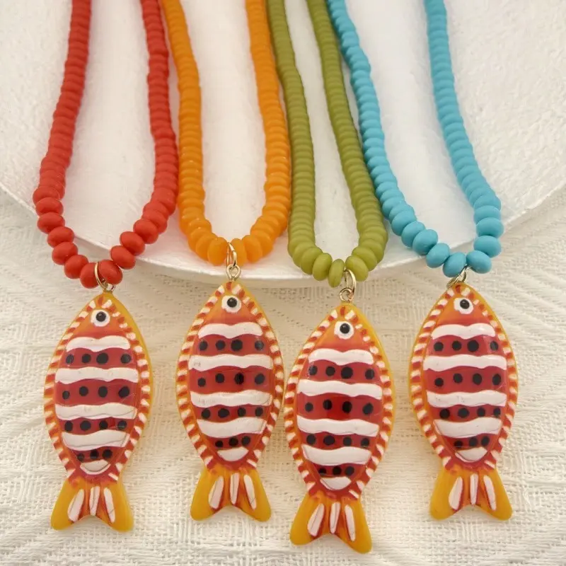 Beachy Ceramic Fish Pendant Necklace for Women, Colorful Beaded Jewelry with Handmade Striped 60x26mm Charm, Fun Statement Accessory, Long, 60×26Mm, Bright Striped Patterns, Casual, Beach Boho Necklace, Fish Inspired Pendant, Beaded Necklaces