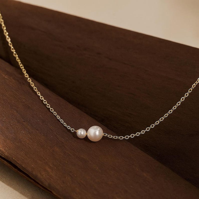 Minimalist Double Pearl Necklace – 14K Gold Plated Dainty Chain Jewelry for Women, Hypoallergenic and Tarnish Resistant, Perfect Elegant Gift for Wedding, Anniversary, or Valentine’s Day Celebration Minimalist Double Pearl Necklace – 14K Gold Plated Dainty Chain Jewelry for Women, Hypoallergenic and Tarnish Resistant, Perfect Elegant Gift for Wedding, Anniversary, or Valentine’s Day Celebration