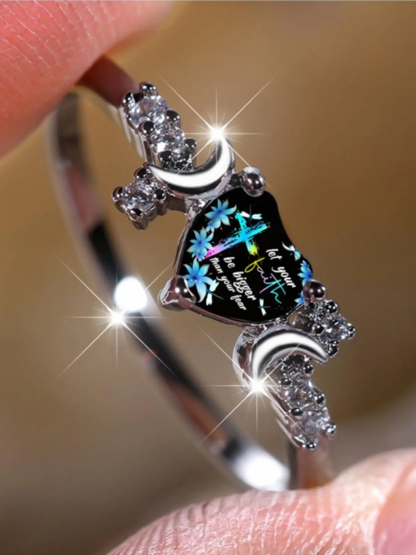 Black background color pattern cross flower elegant ring with double crescent flash diamonds, a light luxury design, symbolizing faith and meaning, a versatile and delicate accessory for daily commuting