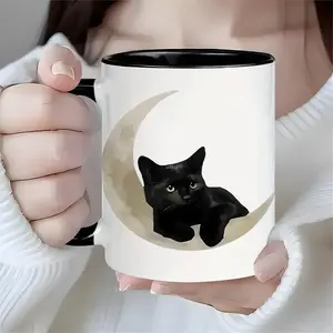 Ceramic coffee cup with black cat moon pattern, designed for reuse and insulation. Ideal choice for coffee enthusiasts, this multifunctional cup is perfect for both men and women, 11oz