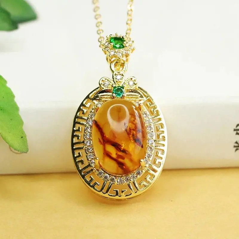 Natural Amber Pendant Necklace, Ethnic Style Floral Design in Gold-Plated Alloy Setting with Embedded Gems, Unisex Appeal, Ethnic Style Design, Pendant Type, Casual, Adults