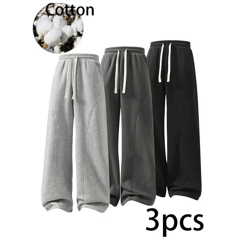 Soft cotton wide leg sweat pants with elastic drawstring waist and unique curved seam detail, loose draped silhouette, breathable casual bottoms, fashionable daily essential for versatile modern mensfashion matching.