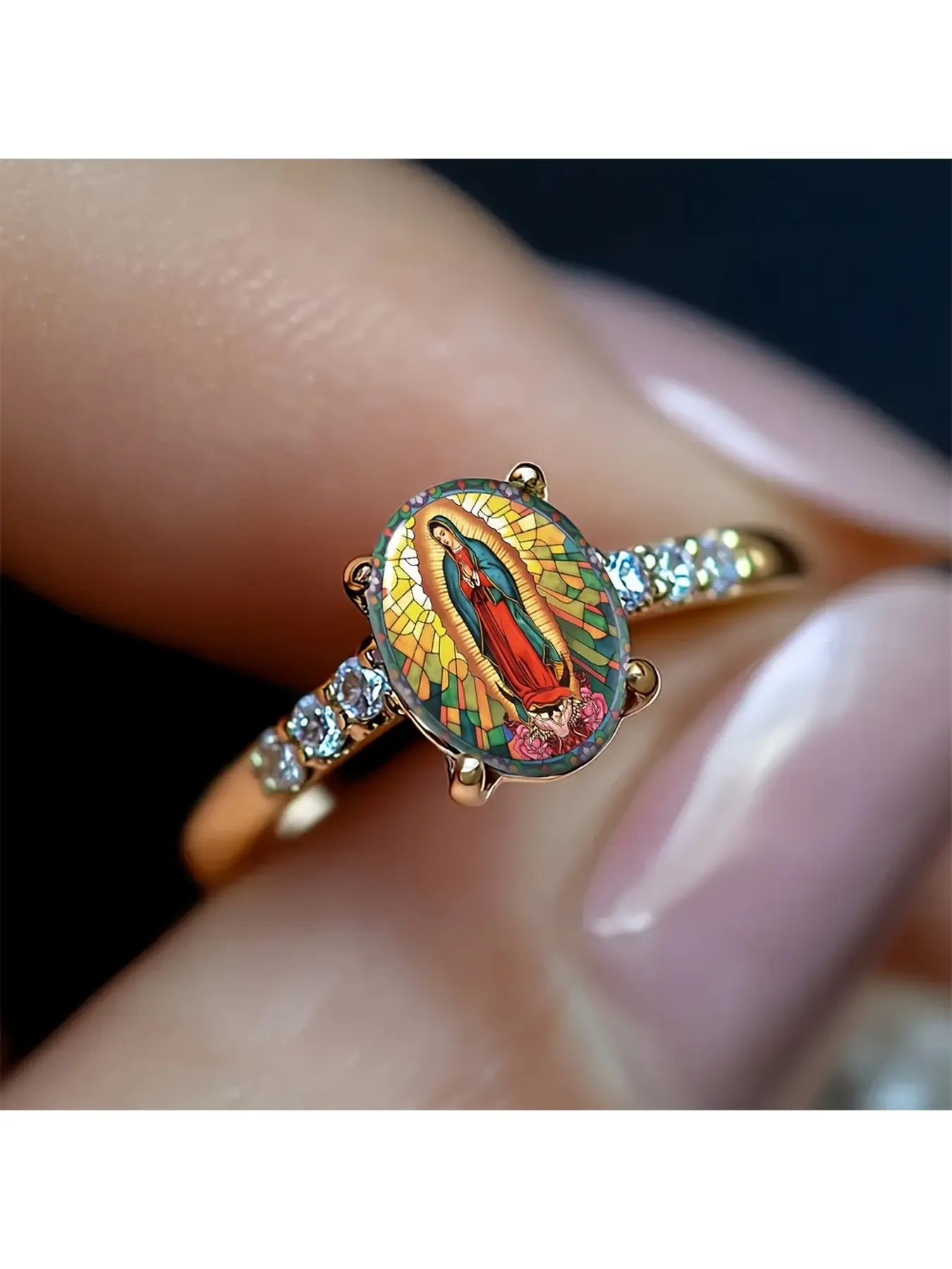 The Guadalupe Virgin painted gold ring is made using the church's colored glass mosaic technique. The colors are brilliant and transparent, depicting the classic image of Guadalupe Virgin of Mexico, accompanied by rose flowers. It is a classic religious s