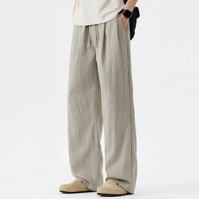 Solid color wrinkled linen drawstring wide leg pants, loose full length silhouette, breathable lightweight fabric, simple side pockets, minimalist casual long trousers for summer daily travel matching outfits