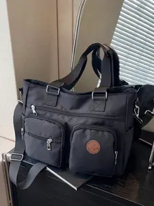Casual and versatile street style personalized tote bag with multiple zippered pockets, reasonable separation, detachable adjustable shoulder strap, simple and relaxed style, fashionable single shoulder handbag, suitable for commuting and shopping