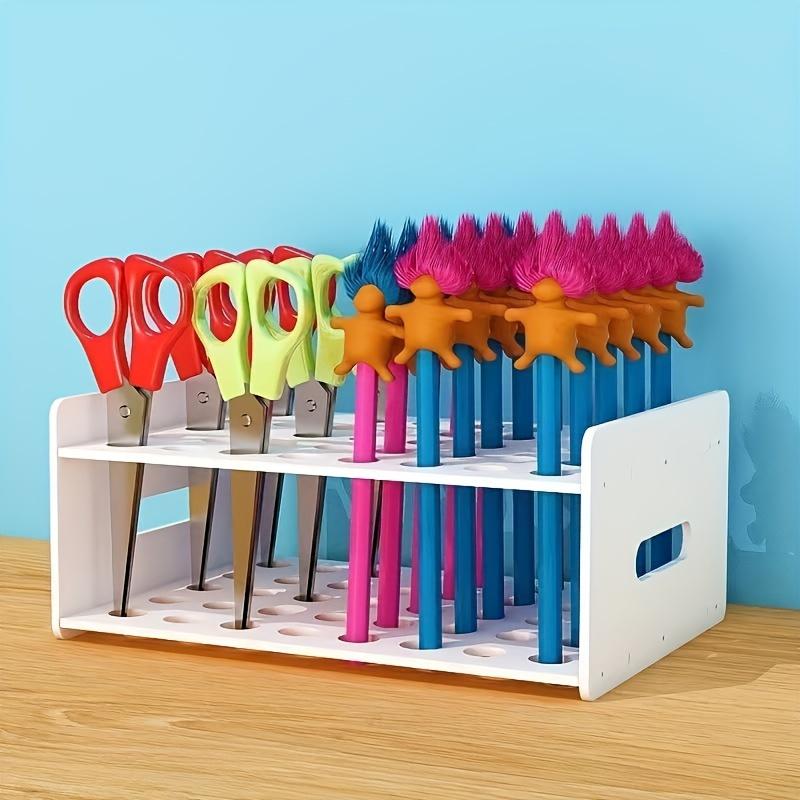 One multi-functional colorful plastic storage box with 35 holes. Neat divided compartments store scissors, brushes and test tubes. Ideal for art, crafts, home and office organization.