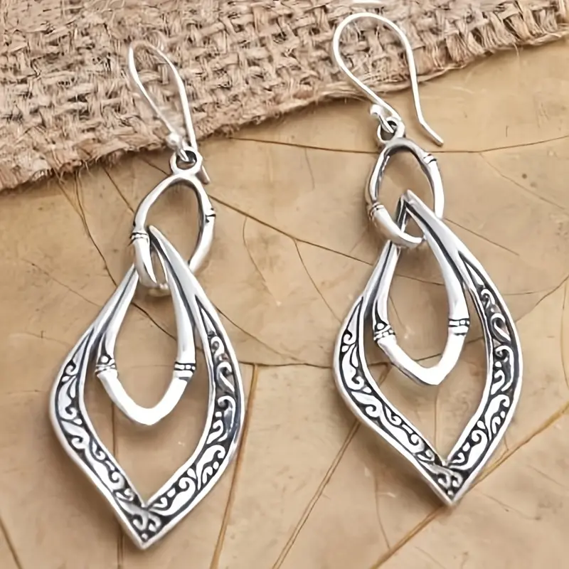 A pair of bohemian-style geometric hollow-carved exquisite zinc alloy earrings
