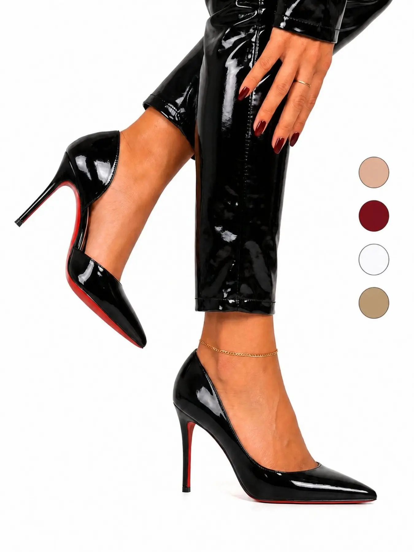 Women's black patent‑leather pointed‑toe stiletto‑heel high‑heeled shoes. The side‑cutout design reduces dullness. These low‑cut hollow‑out red‑soled slip‑on shoes work for both daily commutes and evening parties, boasting wide styling compatibility.