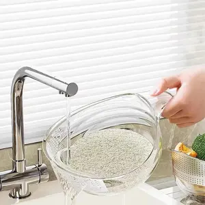 Multifunctional rice washing sieve with handle, vegetable and fruit drain basket, easy-to-use rice and vegetable washing basin for kitchen use.