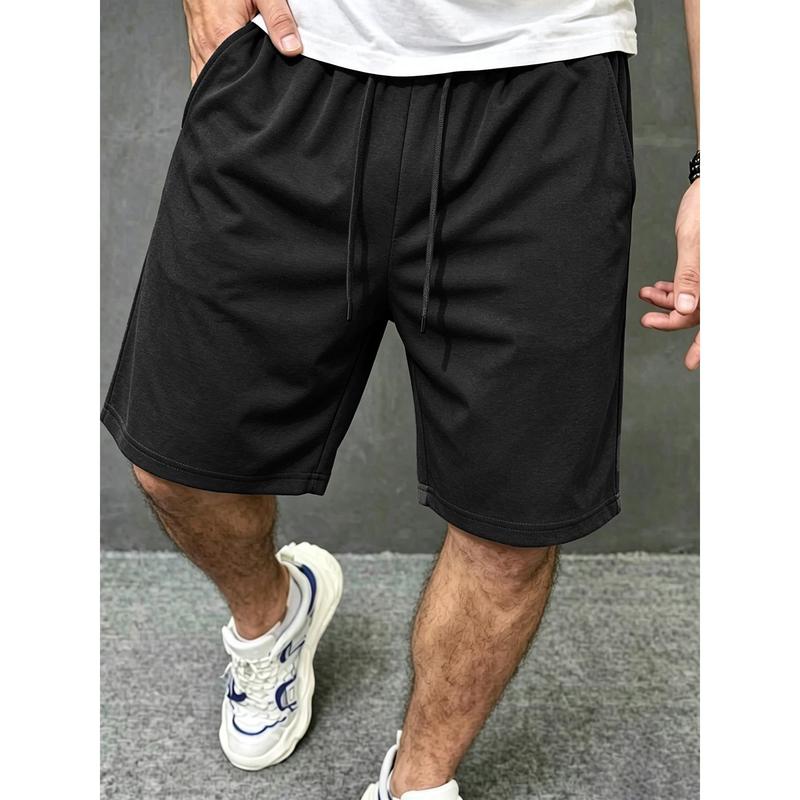 Soft breathable cotton knee-length casual shorts with adjustable dual drawstring elastic waist, loose wide thigh silhouette deep side slip pockets lightweight daily bottom staple for relaxed street mensfashion styling