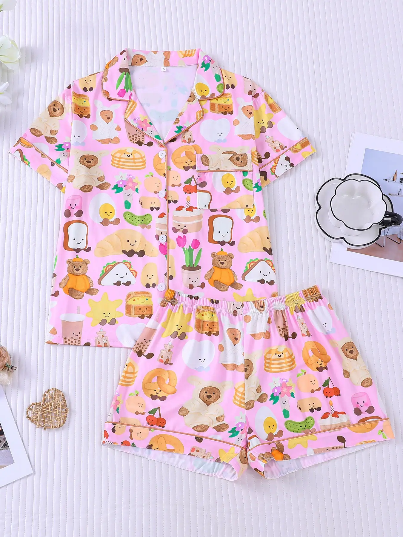Women's 2-piece pajama set, pink base with cute cartoon bear & food print: toast, croissant, milk tea, egg, soft sweet girl style, gold piping trim. Lapel top with pocket, elastic shorts, all-season women casual loungewear Pajama Nightwear Set