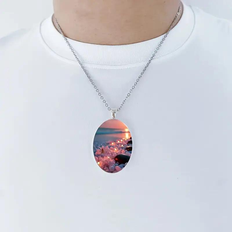 A beautiful summer beach ocean-themed oval-shaped silver alloy glass pendant and stainless steel chain
