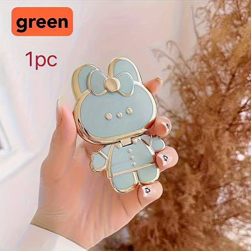 New rabbit-shaped adhesive phone stand with makeup mirror is suitable for iPhone, Samsung, Xiaomi phones, and various other phones. The rabbit phone case desktop stand is a hollow-out lazy stand