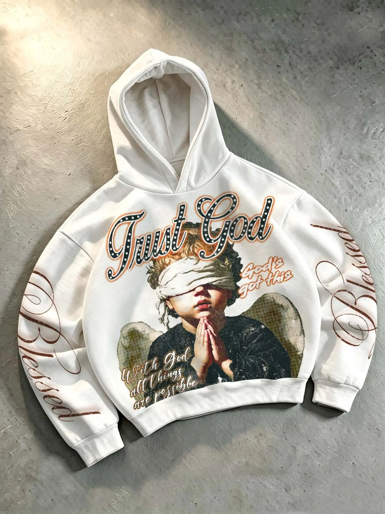 "Praying Angel" Men's Hoodie – Unisex Vintage Y2K Style featuring "Trust God" and "Blessed" in script lettering with rhinestone accents on the sleeves; a loose-fitting, streetwear-inspired hoodie suitable for both men and women.