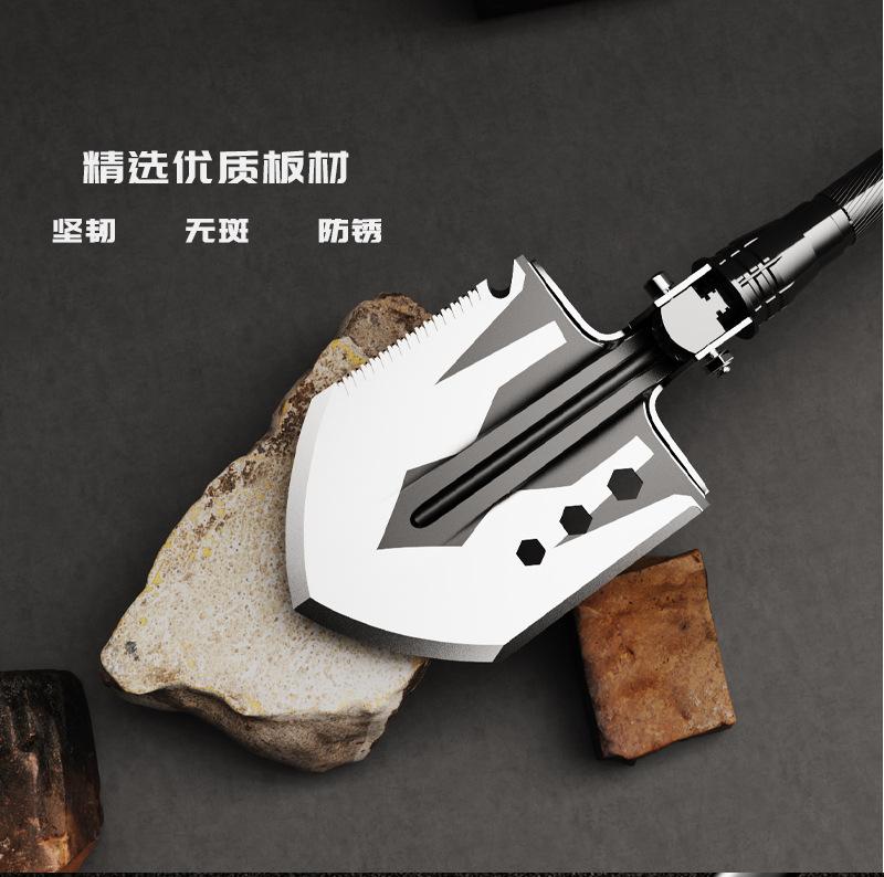 Multifunctional folding shovel, a camping survival tool, equipped with a flint fire starter, suitable for hiking, hunting, fishing, and other outdoor activities