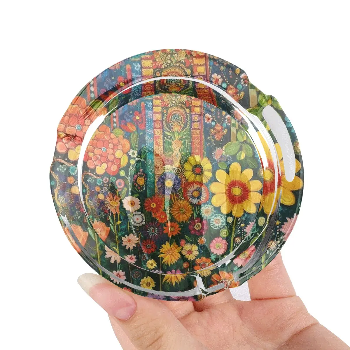 A circular glass ashtray with a non slip base, adorned with vibrant floral art patterns, is an ideal choice for home, office, and garden - combining fashion and practicality, suitable for decoration enthusiasts and smokers