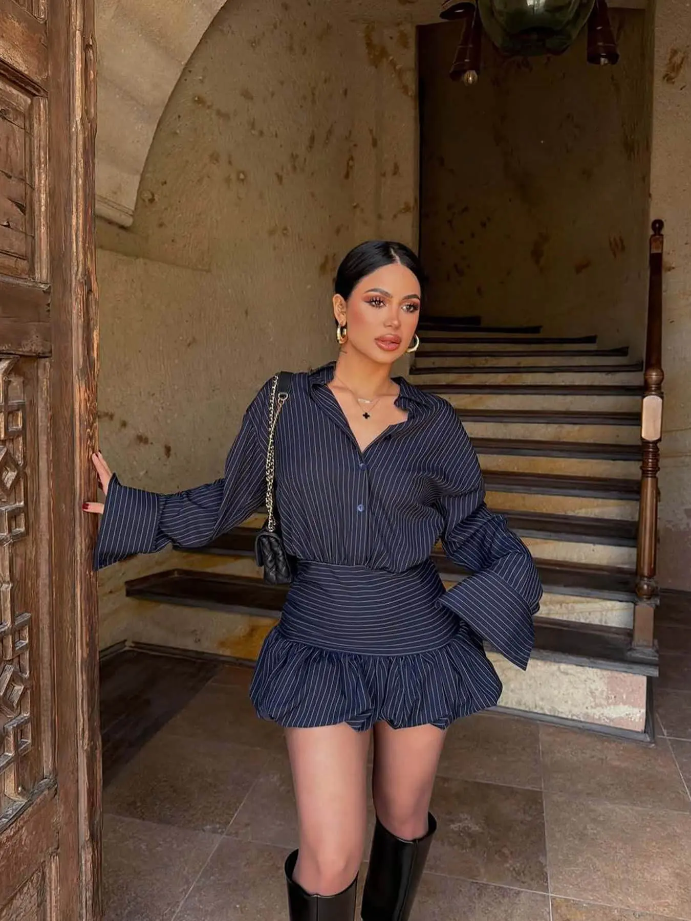 Two piece women's fashion retro solid color vertical stripe spicy girl set with long sleeved shirt and high waisted skirt, suitable for spring and summer, suitable for bars, dates, store visits, travel photos, and holiday gatherings.