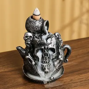 A unique resin skull, designed as a recirculating incense burner, is perfect for Halloween decorations, small prank ornaments and home decorations (without incense)