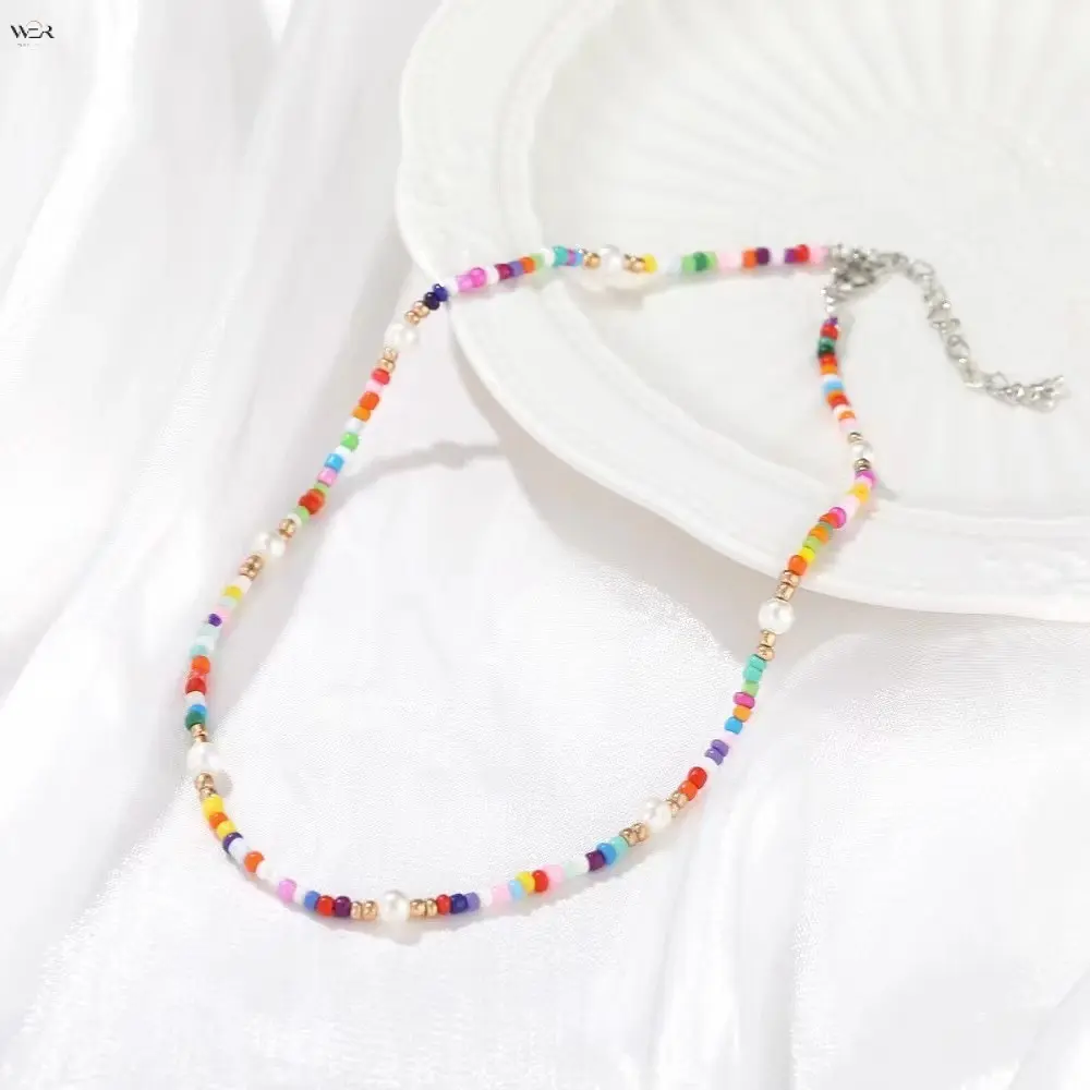Colorful Rainbow Seed Bead Choker Necklace with White Imitation Pearl and Mixed Beads, Adjustable Extension Chain, Perfect for Summer Beach Boho and Minimalist Short Neck Jewelry, Suitable for Women and Teenagers as a Fashion Accessory or Gift.
