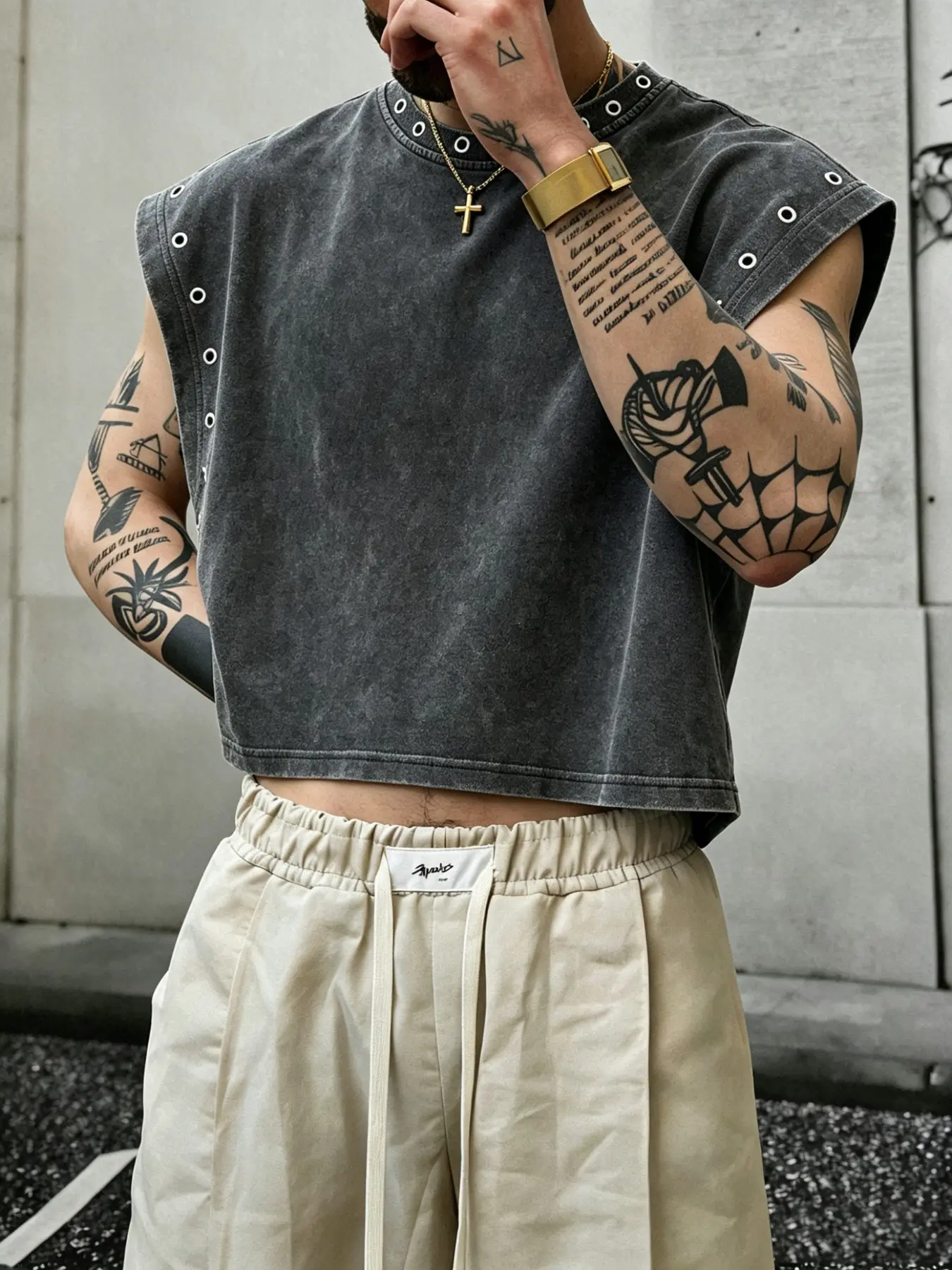 A cropped, loose-fitting casual tank top, Casual fashion clothing, crafted from cotton fabric. The neckline and armholes are accented with eyelet details, exuding a punk aesthetic. Versatile enough for everyday wear, vacations, parties alike