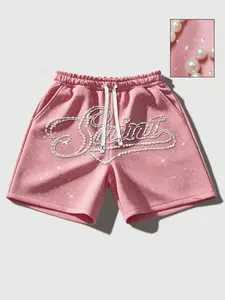 3D nail bead rhinestone sparkling shorts for both men and women, with the slogan 'saint'. Letter shorts for men, nail bead pink shorts for women, fashionable and casual street style, men's shorts, trendy brand 2026 summer new Y2K beach pants, pink