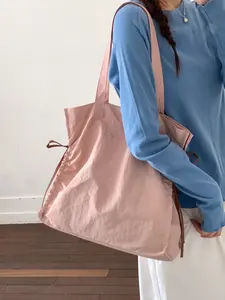 1pc The women's shoulder bag features a large capacity design with embroidered letters on the front, suitable for commuting, school, and daily travel scenarios, gentle and practical.