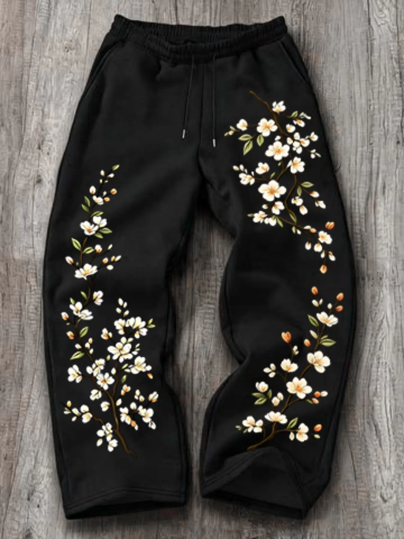 Y2K Floral Print Jogger Pants, Plum Blossom Pattern Elastic Drawstring Trousers, Loose Wide Leg Streetwear Casual Sweat Pants with Side Flower Design#FloralPrintPants #Y2KPants #PlumBlossomPants #StreetwearPants #JoggerPants #WideLegTrousers