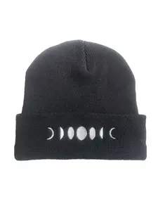 Knitted beanie featuring embroidered lunar phase patterns; a warm, stylish, and unique hip-hop style hat for outdoor wear.