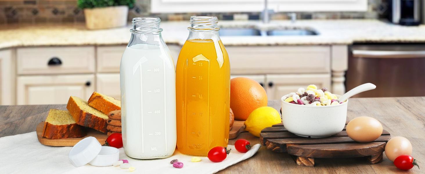 THE WELL KEPT 4 Pack 1 Liter (32 Oz) Glass Milk Bottles With Scale, 100% Airtight Heavy Duty Screw Lids, and 2 Pour Spouts-For Milk, Honey, Jam, Creamer-Dishwasher Safe (Extra 2 Lids Included) Silicone Beverage